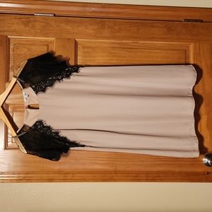 Tan dress with black lace sleeves